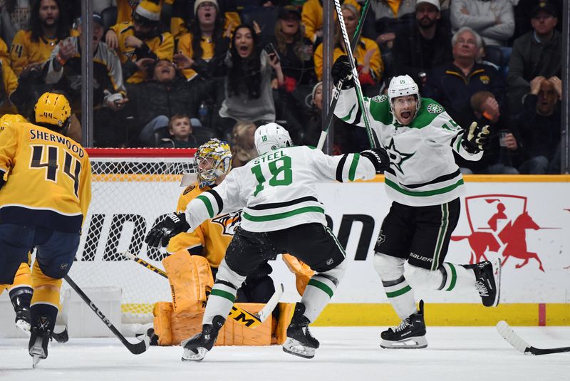 Dec 23, 2023; Nashville, Tennessee, USA; Dallas Stars center Craig Smith (15) and center Sam Steel (18) celebrate after defenseman Jani Hakanpaa (not pictured) scored the winning goal during the third period against the Nashville Predators at Bridgestone Arena. Mandatory Credit: Christopher Hanewinckel-USA TODAY Sports