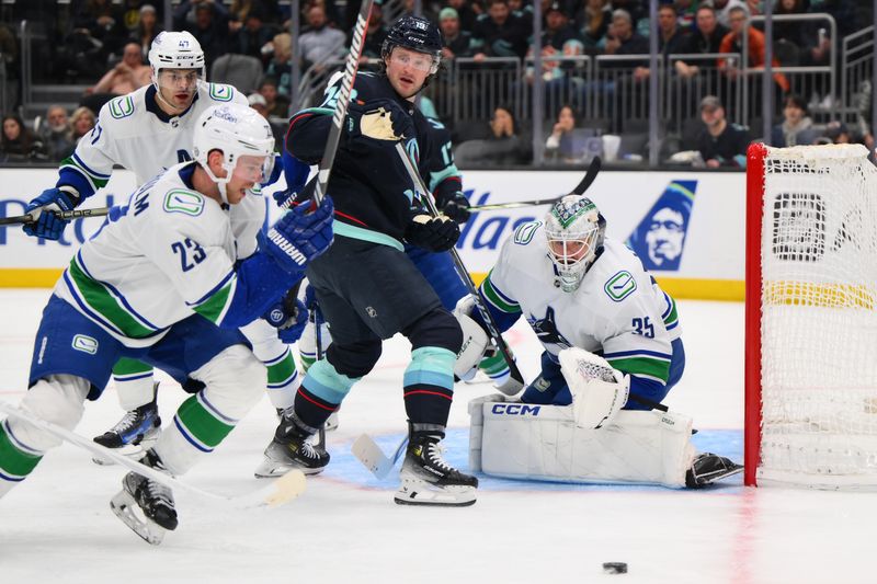 Feb 22, 2024; Seattle, Washington, USA; Vancouver Canucks goaltender Thatcher Demko (35) defends the goal against the Seattle Kraken during the second period at Climate Pledge Arena. Mandatory Credit: Steven Bisig-USA TODAY Sports