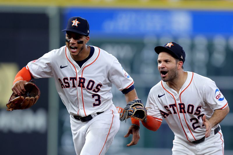Jul 13, 2024; Houston, Texas, USA; Houston Astros shortstop Jeremy Pena (3) and Houston Astros second baseman Jose Altuve (27) reacts after an out against the Texas Rangers during the sixth inning at Minute Maid Park. Mandatory Credit: Erik Williams-USA TODAY Sports