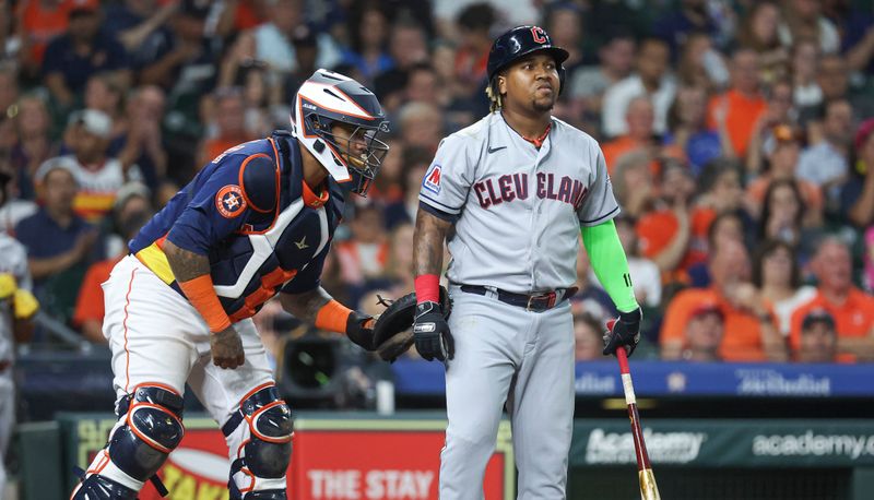 Aug 1, 2023; Houston, Texas, USA; Houston Astros catcher Martin Maldonado (15) applies a tag to Cleveland Guardians third baseman Jose Ramirez (11) after a strikeout during the fourth inning at Minute Maid Park. Mandatory Credit: Troy Taormina-USA TODAY Sports