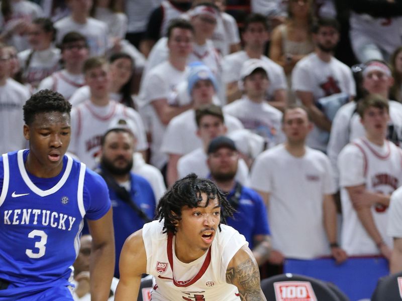 Mar 4, 2023; Fayetteville, Arkansas, USA; Arkansas Razorbacks guard Nick Smith Jr (3) dribbles around Kentucky Wildcats guard Adou Thiero (3) during the second half at Bud Walton Arena. Kentucky won 88-79. Mandatory Credit: Nelson Chenault-USA TODAY Sports