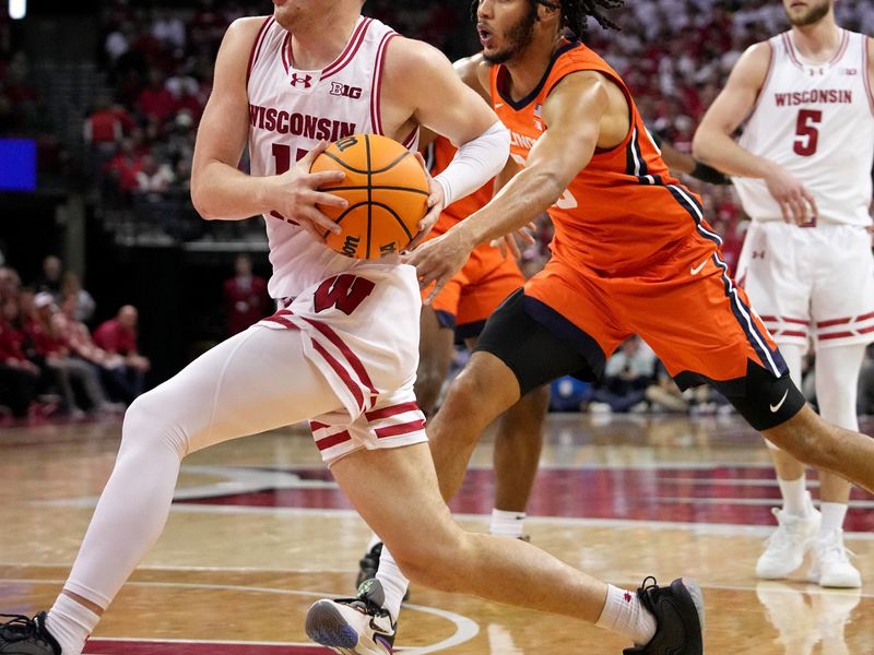 Mar 2, 2024; Madison, WI, USA;  Wisconsin guard Max Klesmit (11) drives past Illinois forward Ty Rodgers (20) during the second half of their game Saturday, March 2, 2024 at the Kohl Center in Madison, Wisconsin.  Mandatory Credit: Mark Hoffman-USA TODAY Sports
