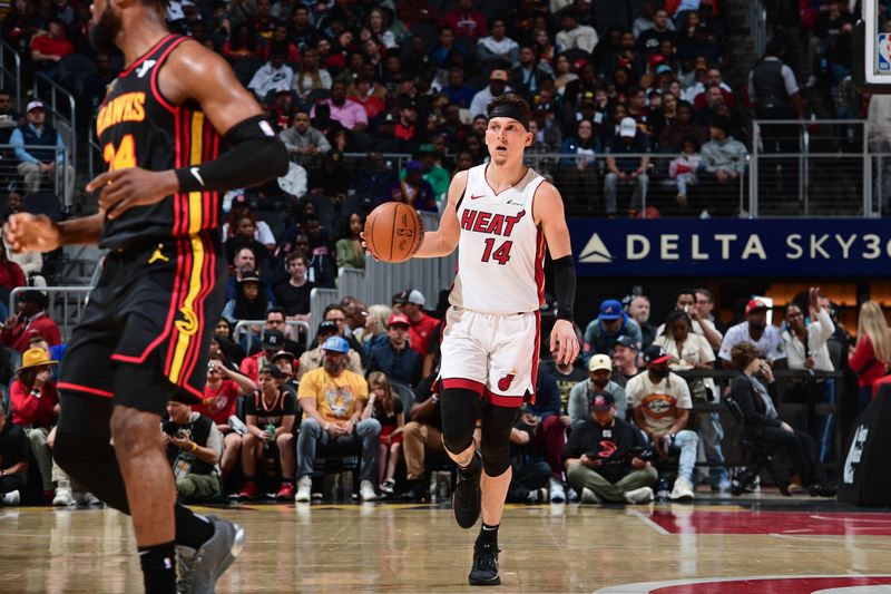 ATLANTA, GA - APRIL 9: Tyler Herro #14 of the Miami Heat dribbles the ball during the game against the Atlanta Hawks on April 9, 2024 at State Farm Arena in Atlanta, Georgia.  NOTE TO USER: User expressly acknowledges and agrees that, by downloading and/or using this Photograph, user is consenting to the terms and conditions of the Getty Images License Agreement. Mandatory Copyright Notice: Copyright 2024 NBAE (Photo by Scott Cunningham/NBAE via Getty Images)