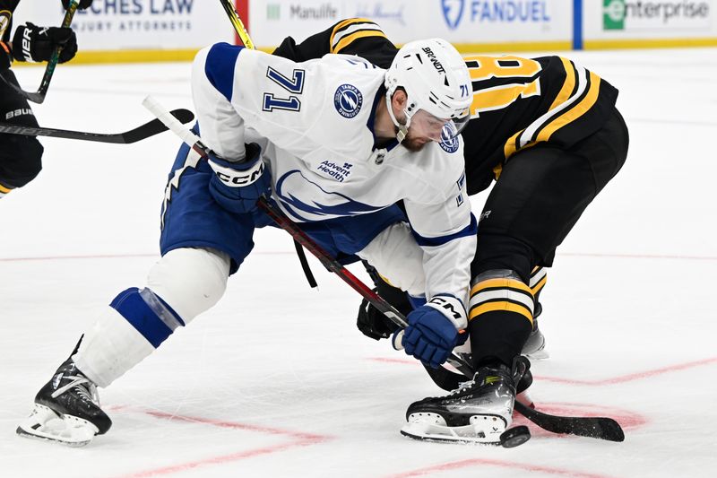 Mar 15, 2025; Boston, Massachusetts, USA; Tampa Bay Lightning center Anthony Cirelli (71) wins a face-off against Boston Bruins center Pavel Zacha (18) during the third period at TD Garden. Mandatory Credit: Eric Canha-Imagn Images