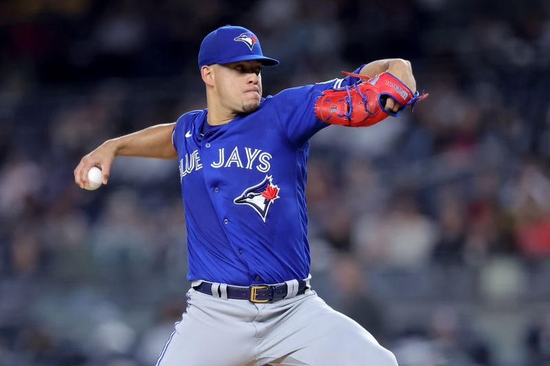 Sep 21, 2023; Bronx, New York, USA; Toronto Blue Jays starting pitcher Jose Berrios (17) pitches against the New York Yankees during the first inning at Yankee Stadium. Mandatory Credit: Brad Penner-USA TODAY Sports