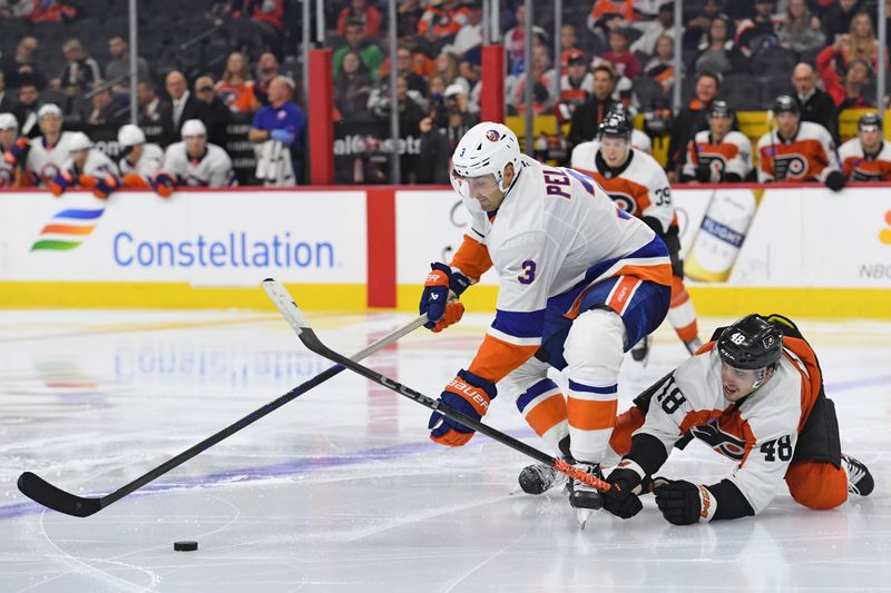 Sep 26, 2024; Philadelphia, Pennsylvania, USA; New York Islanders defenseman Adam Pelech (3) and Philadelphia Flyers center Morgan Frost (48) battle for the puck during the third period at Wells Fargo Center. Mandatory Credit: Eric Hartline-Imagn Images