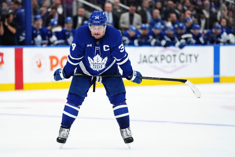 Oct 19, 2024; Toronto, Ontario, CAN; Toronto Maple Leafs center Auston Matthews (34) waits for a faceoff against the New York Rangers during the third period at Scotiabank Arena. Mandatory Credit: Nick Turchiaro-Imagn Images