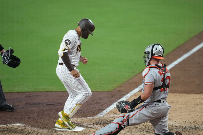 Aug 16, 2023; San Diego, California, USA;  San Diego Padres center fielder Trent Grisham (1) touches home plate after hitting a solo home run against the Baltimore Orioles during the seventh inning at Petco Park. Mandatory Credit: Ray Acevedo-USA TODAY Sports