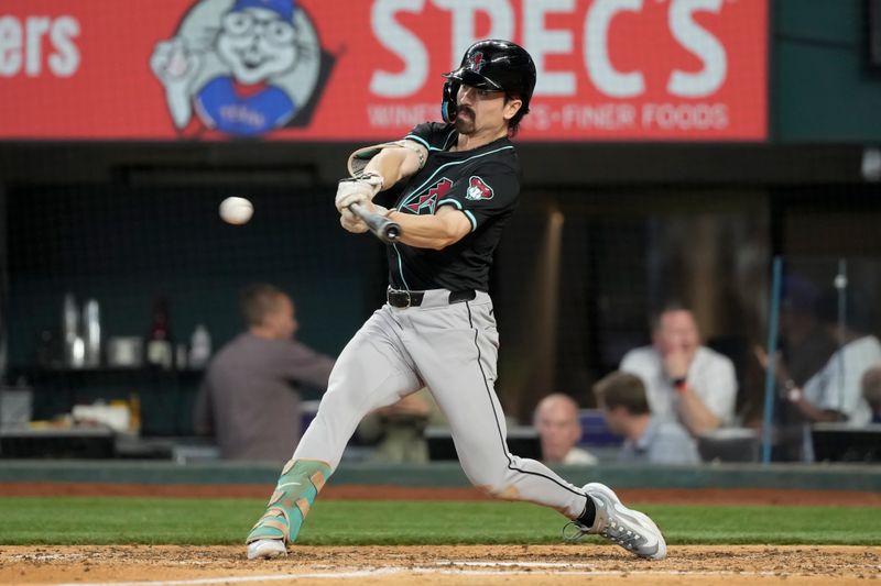 May 29, 2024; Arlington, Texas, USA; Arizona Diamondbacks center fielder Corbin Carroll (7) connects for a single against the Texas Rangers during the seventh inning at Globe Life Field. Mandatory Credit: Jim Cowsert-USA TODAY Sports