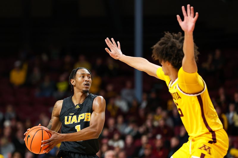 Nov 21, 2023; Minneapolis, Minnesota, USA; Arkansas-Pine Bluff Golden Lions guard Kylen Milton (1) controls the ball as Minnesota Golden Gophers forward Kadyn Betts (15) defends during the second half at Williams Arena. Mandatory Credit: Matt Krohn-USA TODAY Sports