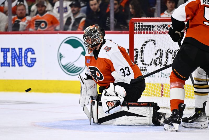 Jan 27, 2024; Philadelphia, Pennsylvania, USA; Philadelphia Flyers goalie Samuel Ersson (33) watches the puck against the Boston Bruins in the first period at Wells Fargo Center. Mandatory Credit: Kyle Ross-USA TODAY Sports