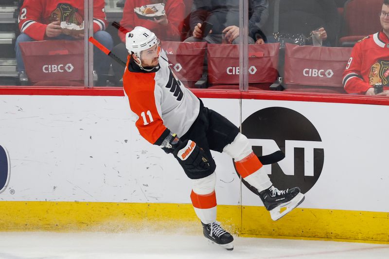 Feb 21, 2024; Chicago, Illinois, USA; Philadelphia Flyers right wing Travis Konecny (11) reacts after scoring against the Chicago Blackhawks during the second period at United Center. Mandatory Credit: Kamil Krzaczynski-USA TODAY Sports