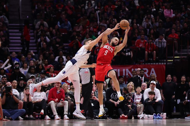 HOUSTON, TEXAS - JANUARY 01: Dillon Brooks #9 of the Houston Rockets rebounds the ball against Maxi Kleber #42 of the Dallas Mavericks during the second half at Toyota Center on January 01, 2025 in Houston, Texas. NOTE TO USER: User expressly acknowledges and agrees that, by downloading and or using this photograph, User is consenting to the terms and conditions of the Getty Images License Agreement. (Photo by Alex Slitz/Getty Images)