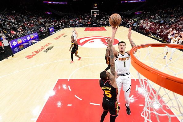 ATLANTA, GA - DECEMBER 11: Michael Porter Jr. #1 of the Denver Nuggets shoots the ball during the game against the Atlanta Hawks on December 11, 2023 at State Farm Arena in Atlanta, Georgia.  NOTE TO USER: User expressly acknowledges and agrees that, by downloading and/or using this Photograph, user is consenting to the terms and conditions of the Getty Images License Agreement. Mandatory Copyright Notice: Copyright 2023 NBAE (Photo by Adam Hagy/NBAE via Getty Images)