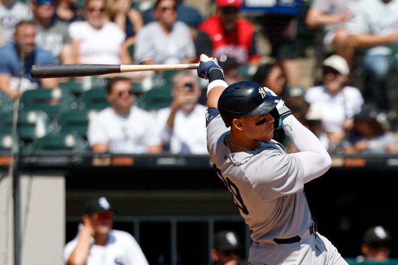 Aug 31, 2025; Chicago, Illinois, USA; New York Yankees designated hitter Aaron Judge (99) hits a solo home run against the Chicago White Sox during the first inning at Rate Field. Mandatory Credit: Kamil Krzaczynski-Imagn Images