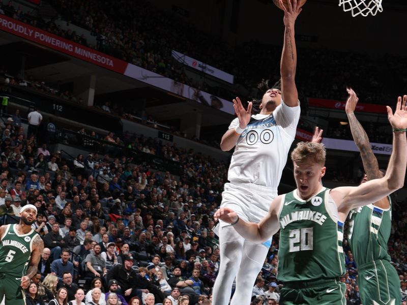 MINNEAPOLIS, MN -  FEBRUARY 12: Terrence Shannon Jr. #00 of the Minnesota Timberwolves drives to the basket during the game against the Milwaukee Bucks on February 12, 2025 at Target Center in Minneapolis, Minnesota. NOTE TO USER: User expressly acknowledges and agrees that, by downloading and or using this Photograph, user is consenting to the terms and conditions of the Getty Images License Agreement. Mandatory Copyright Notice: Copyright 2025 NBAE (Photo by David Sherman/NBAE via Getty Images)