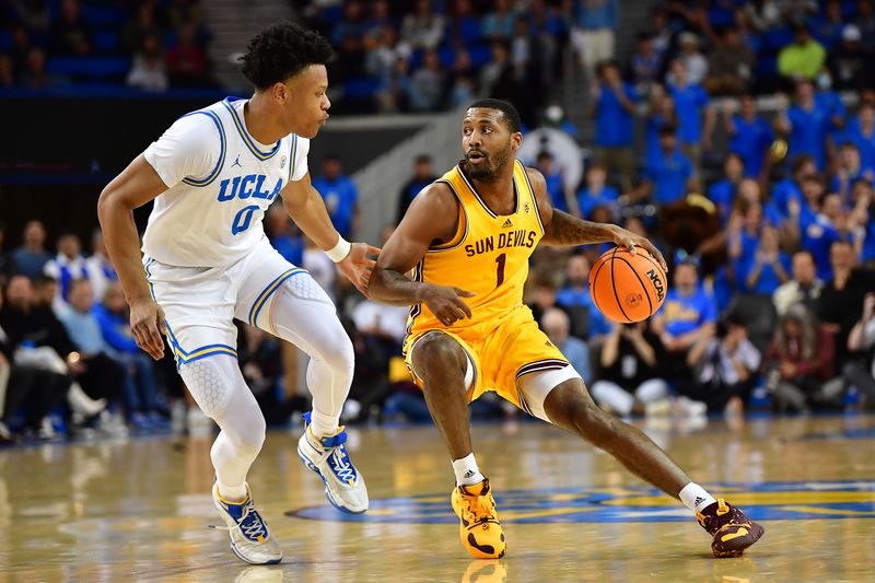 Mar 2, 2023; Los Angeles, California, USA; Arizona State Sun Devils guard Luther Muhammad (1) moves the ball against UCLA Bruins guard Jaylen Clark (0) during the first half at Pauley Pavilion. Mandatory Credit: Gary A. Vasquez-USA TODAY Sports