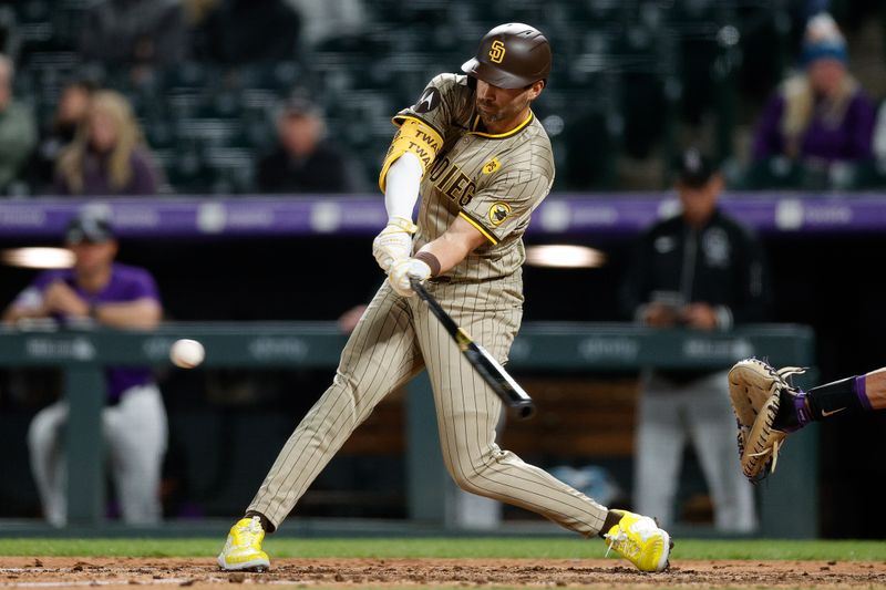 Apr 22, 2024; Denver, Colorado, USA; San Diego Padres pinch hitter Tyler Wade (14) hits an RBI double in the eighth inning against the Colorado Rockies at Coors Field. Mandatory Credit: Isaiah J. Downing-USA TODAY Sports