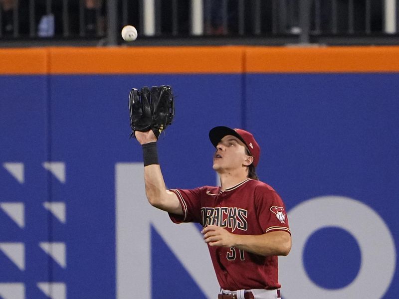 Sep 13, 2023; New York City, New York, USA; Arizona Diamondbacks center fielder Jake McCarthy (31) catches a fly ball hit by New York Mets left fielder Brandon Nimmo (not pictured) during the eighth inning at Citi Field. Mandatory Credit: Gregory Fisher-USA TODAY Sports