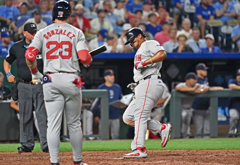 Aug 5, 2024; Kansas City, Missouri, USA;  Boston Red Sox third baseman Rafael Devers (11) scores a run on a wild pitch in the seventh inning against the Kansas City Royals at Kauffman Stadium. Mandatory Credit: Peter Aiken-USA TODAY Sports