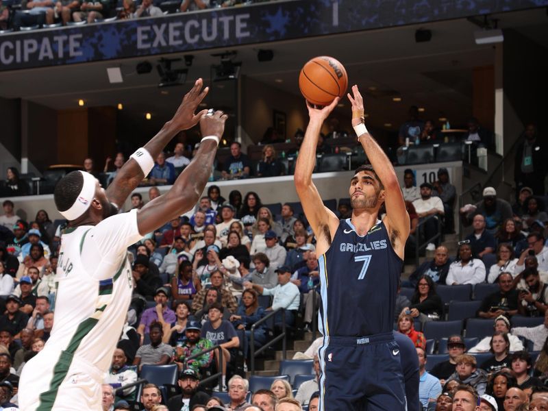 MEMPHIS, TN - OCTOBER 31: Santi Aldama #7 of the Memphis Grizzlies shoots a three point basket during the game against the Milwaukee Bucks on October 31, 2024 at FedExForum in Memphis, Tennessee. NOTE TO USER: User expressly acknowledges and agrees that, by downloading and or using this photograph, User is consenting to the terms and conditions of the Getty Images License Agreement. Mandatory Copyright Notice: Copyright 2024 NBAE (Photo by Joe Murphy/NBAE via Getty Images)