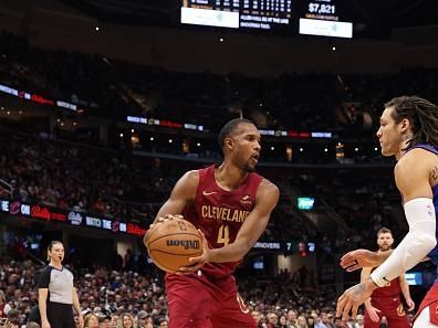 CLEVELAND, OH - NOVEMBER 19: Evan Mobley #4 of the Cleveland Cavaliers looks to pass the ball during the game against the Denver Nuggets on November 19, 2023 at Rocket Mortgage FieldHouse in Cleveland, Ohio. NOTE TO USER: User expressly acknowledges and agrees that, by downloading and/or using this Photograph, user is consenting to the terms and conditions of the Getty Images License Agreement. Mandatory Copyright Notice: Copyright 2023 NBAE (Photo by Lauren Leigh Bacho/NBAE via Getty Images)