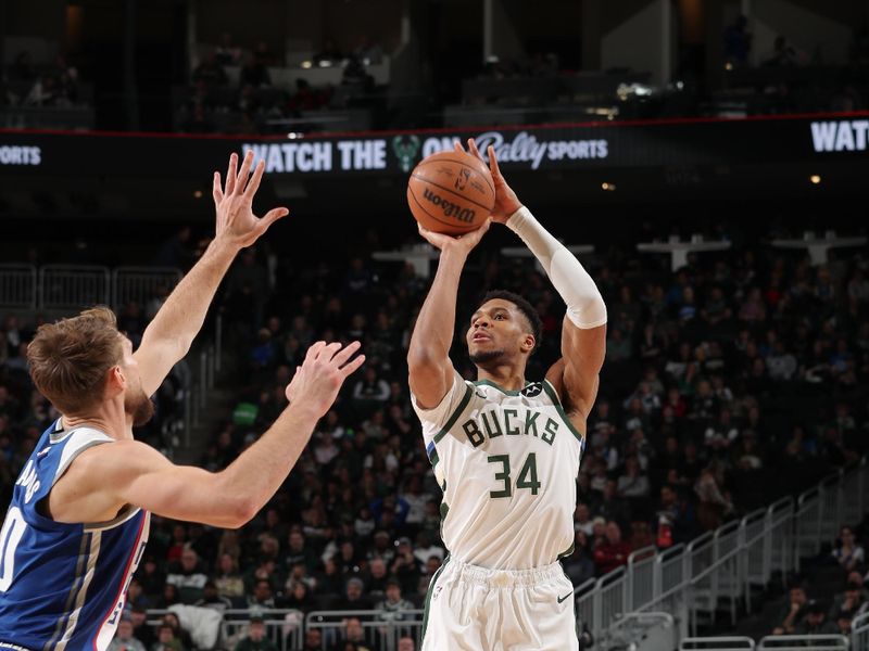 MILWAUKEE, WI - JANUARY 14: Giannis Antetokounmpo #34 of the Milwaukee Bucks shoots a three point basket during the game against the Sacramento Kings on January 14, 2024 at the Fiserv Forum Center in Milwaukee, Wisconsin. NOTE TO USER: User expressly acknowledges and agrees that, by downloading and or using this Photograph, user is consenting to the terms and conditions of the Getty Images License Agreement. Mandatory Copyright Notice: Copyright 2024 NBAE (Photo by Gary Dineen/NBAE via Getty Images).