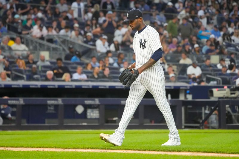 Jun 22, 2023; Bronx, New York, USA; New York Yankees pitcher Domingo German (0) walks to the dugout after being taken out of the game against the Seattle Mariners during the fourth inning at Yankee Stadium. Mandatory Credit: Gregory Fisher-USA TODAY Sports