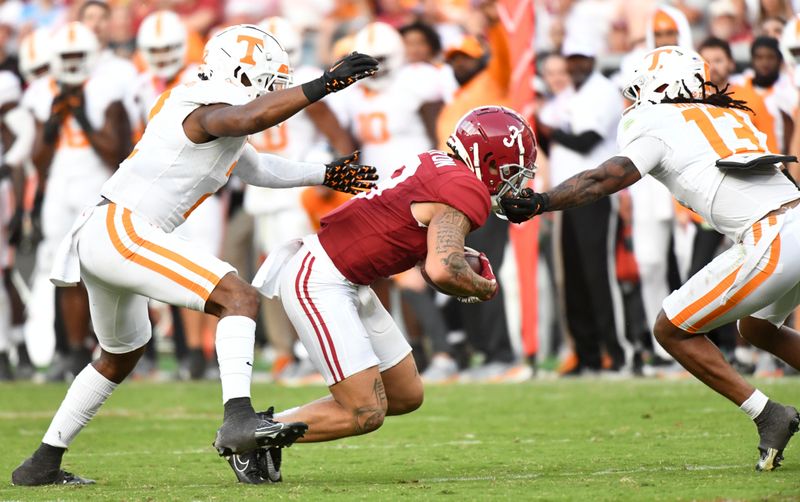 Oct 21, 2023; Tuscaloosa, Alabama, USA;  Tennessee Volunteers defensive back Wesley Walker (13) attempts to tackle Alabama Crimson Tide wide receiver Jermaine Burton (3) at Bryant-Denny Stadium. Alabama defeated Tennessee 34-20. Mandatory Credit: Gary Cosby Jr.-USA TODAY Sports