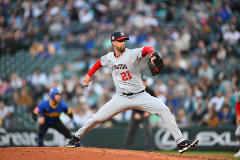 May 29, 2025; Seattle, Washington, USA; Washington Nationals relief pitcher Jorge Lopez (21) pitches to the Seattle Mariners during the seventh inning at T-Mobile Park. Mandatory Credit: Steven Bisig-Imagn Images