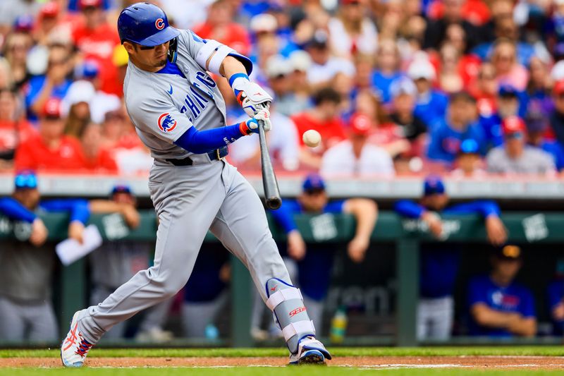 May 25, 2025; Cincinnati, Ohio, USA; Chicago Cubs designated hitter Seiya Suzuki (27) hits a single in the first inning against the Cincinnati Reds at Great American Ball Park. Mandatory Credit: Katie Stratman-Imagn Images