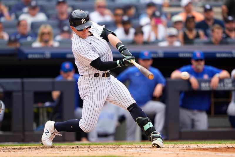 Jul 8, 2023; Bronx, New York, USA; New York Yankees center fielder Harrison Bader (22) hits an RBI double against the Chicago Cubs during the third inning at Yankee Stadium. Mandatory Credit: Gregory Fisher-USA TODAY Sports