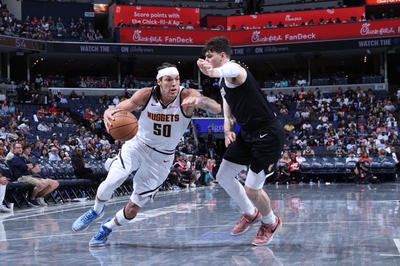 MEMPHIS, TN - APRIL 14:  Aaron Gordon #50 of the Denver Nuggets handles the ball during the game against the Memphis Grizzlies on April 14, 2024 at FedExForum in Memphis, Tennessee. NOTE TO USER: User expressly acknowledges and agrees that, by downloading and or using this photograph, User is consenting to the terms and conditions of the Getty Images License Agreement. Mandatory Copyright Notice: Copyright 2024 NBAE (Photo by Joe Murphy/NBAE via Getty Images)