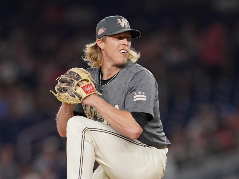 Jun 14, 2024; Washington, District of Columbia, USA; Washington Nationals relief pitcher Jordan Weems (51) throws the ball for the final out against the Miami Marlins in the ninth inning at Nationals Park. Mandatory Credit: Amber Searls-USA TODAY Sports