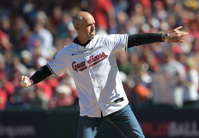 Oct 5, 2024; Cleveland, OH, USA;  Cleveland Indians former player Travis Fryman throws out the ceremonial first pitch before game one of the ALDS between the Detroit Tigers and Cleveland Guardians for the 2024 MLB Playoffs at Progressive Field. Mandatory Credit: Ken Blaze-Imagn Images