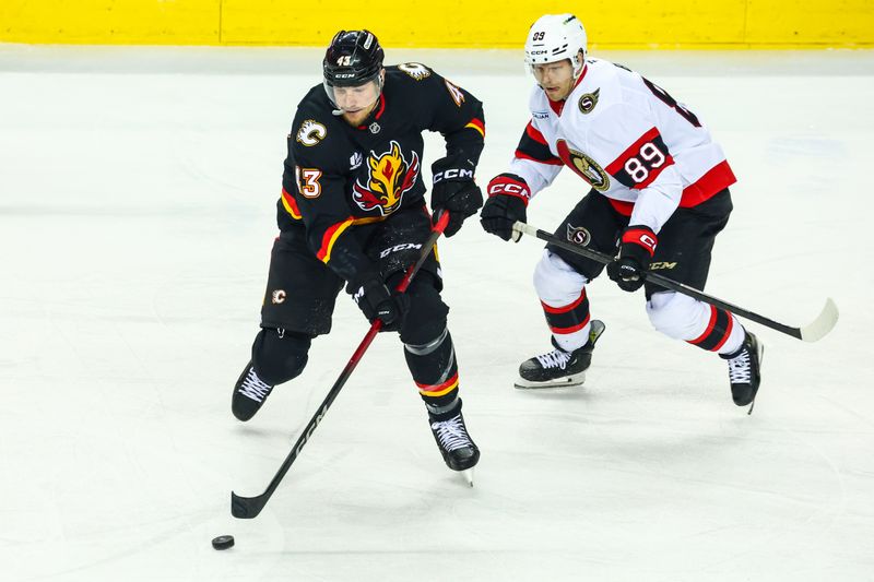 Mar 5, 2026; Calgary, Alberta, CAN; Calgary Flames right wing Adam Klapka (43) controls the puck against Ottawa Senators center Lars Eller (89) during the first period at Scotiabank Saddledome. Mandatory Credit: Sergei Belski-Imagn Images
