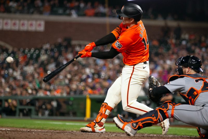 Aug 9, 2024; San Francisco, California, USA; San Francisco Giants catcher Patrick Bailey (14) hits a sacrifice fly against the Detroit Tigers during the eighth inning at Oracle Park. Mandatory Credit: D. Ross Cameron-USA TODAY Sports