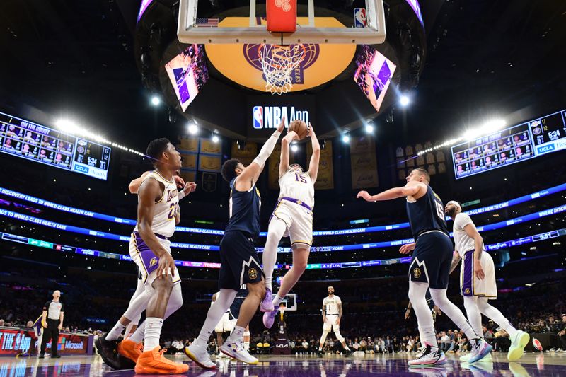 LOS ANGELES, CA - APRIL 27: Austin Reaves #15 of the Los Angeles Lakers drives to the basket during the game against the Denver Nuggets during Round 1 Game 4 of the 2024 NBA Playoffs on April 27, 2024 at Crypto.Com Arena in Los Angeles, California. NOTE TO USER: User expressly acknowledges and agrees that, by downloading and/or using this Photograph, user is consenting to the terms and conditions of the Getty Images License Agreement. Mandatory Copyright Notice: Copyright 2024 NBAE (Photo by Adam Pantozzi/NBAE via Getty Images)