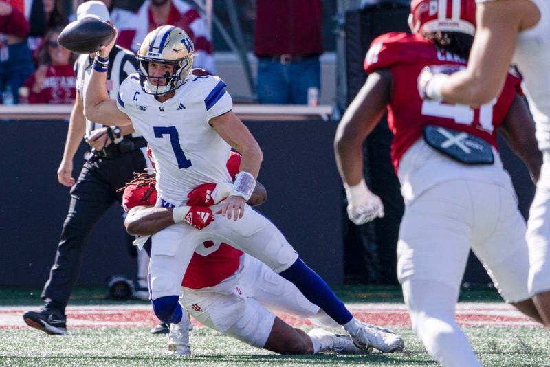 Oct 26, 2024; Bloomington, Indiana, USA; Washington Huskies quarterback Will Rogers (7) is tackled by Indiana Hoosiers defensive lineman Mikail Kamara (6) during the first quarter at Memorial Stadium. Mandatory Credit: Jacob Musselman-Imagn Images