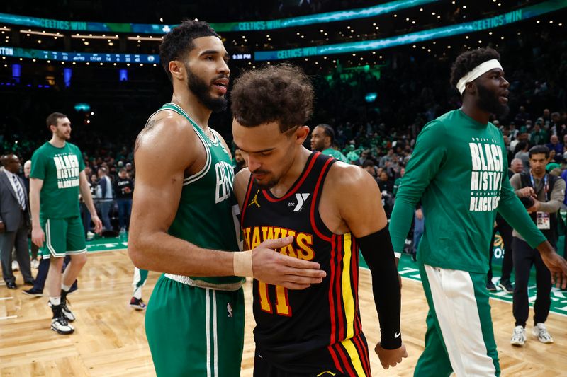 BOSTON, MA - FEBRUARY 7: Jayson Tatum #0 of the Boston Celtics and Trae Young #11 of the Atlanta Hawks meet on the floor after a Celtics 125-117 win at TD Garden on February 7, 2024 in Boston, Massachusetts. NOTE TO USER: User expressly acknowledges and agrees that, by downloading and/or using this Photograph, user is consenting to the terms and conditions of the Getty Images License Agreement. (Photo By Winslow Townson/Getty Images)