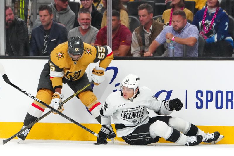 Oct 22, 2024; Las Vegas, Nevada, USA; Vegas Golden Knights right wing Keegan Kolesar (55) looks to control the puck after Los Angeles Kings left wing Trevor Moore (12) falls to the ice during the first period at T-Mobile Arena. Mandatory Credit: Stephen R. Sylvanie-Imagn Images