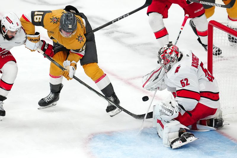 Nov 11, 2024; Las Vegas, Nevada, USA; Carolina Hurricanes goaltender Pyotr Kochetkov (52) makes a save against Vegas Golden Knights left wing Pavel Dorofeyev (16) during the third period at T-Mobile Arena. Mandatory Credit: Stephen R. Sylvanie-Imagn Images