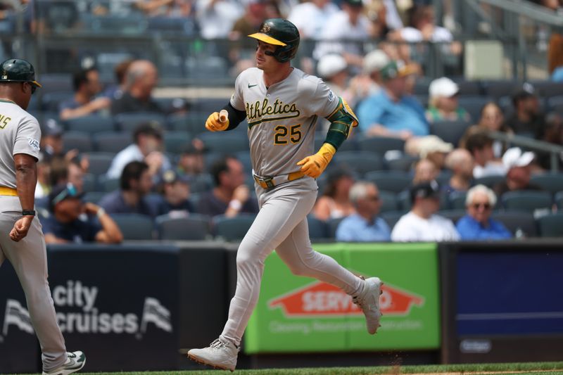 Jun 28, 2025; Bronx, New York, USA;  Athletics designated hitter Brent Rooker (25) rounds third base after his solo home run during the fourth inning against the New York Yankees at Yankee Stadium. Mandatory Credit: Vincent Carchietta-Imagn Images