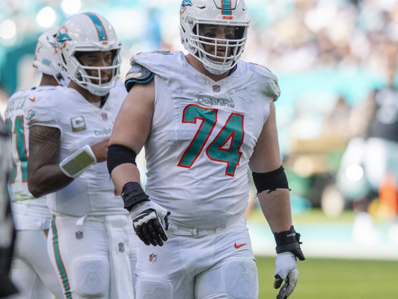 Miami Dolphins offensive tackle Liam Eichenberg (74) walks to the huddle during the first half of an NFL football game against the Las Vegas Raiders, Sunday, Nov. 19, 2023, in Miami Gardens, Fla. (AP Photo/Michael Laughlin)