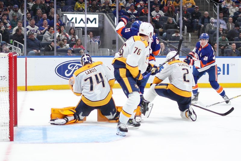 Mar 1, 2025; Elmont, New York, USA;  New York Islanders center Brock Nelson (29) shot gets past Nashville Predators goaltender Juuse Saros (74) for a goal during the second period at UBS Arena. Mandatory Credit: Thomas Salus-Imagn Images