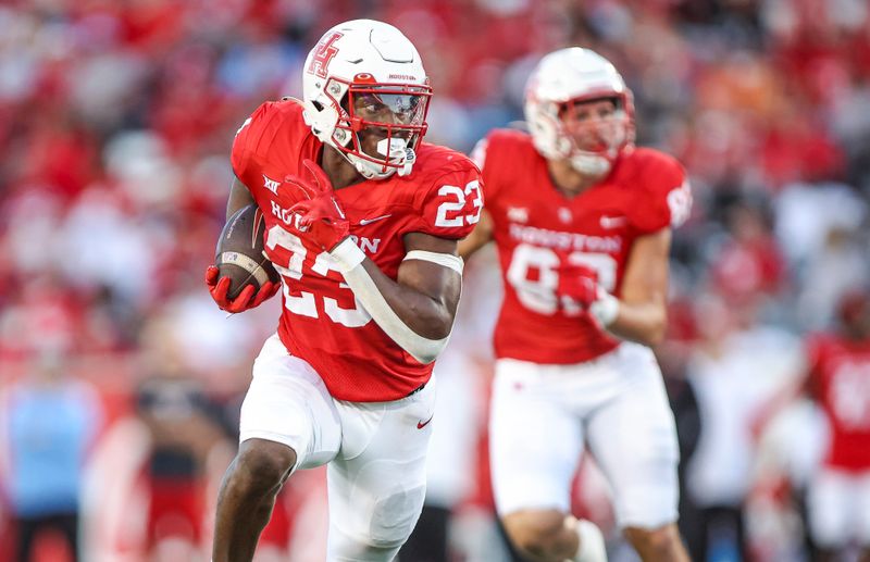 Sep 23, 2023; Houston, Texas, USA; Houston Cougars running back Parker Jenkins (23) runs with the ball during the second quarter against the Sam Houston State Bearkats at TDECU Stadium. Mandatory Credit: Troy Taormina-USA TODAY Sports