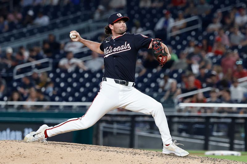 Jun 4, 2024; Washington, District of Columbia, USA; Washington Nationals pitcher Kyle Finnegan (67) pitches against the New York Mets during the ninth inning at Nationals Park. Mandatory Credit: Geoff Burke-USA TODAY Sports