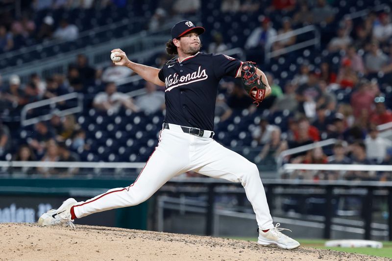 Jun 4, 2024; Washington, District of Columbia, USA; Washington Nationals pitcher Kyle Finnegan (67) pitches against the New York Mets during the ninth inning at Nationals Park. Mandatory Credit: Geoff Burke-USA TODAY Sports