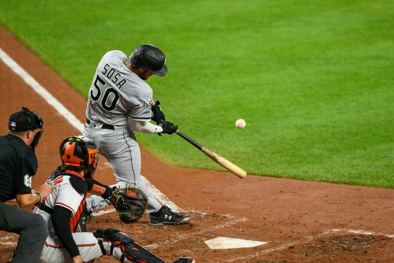 Aug 29, 2023; Baltimore, Maryland, USA; Chicago White Sox second baseman Lenyn Sosa (50) hits a home run during the third inning against the Baltimore Orioles at Oriole Park at Camden Yards. Mandatory Credit: Reggie Hildred-USA TODAY Sports