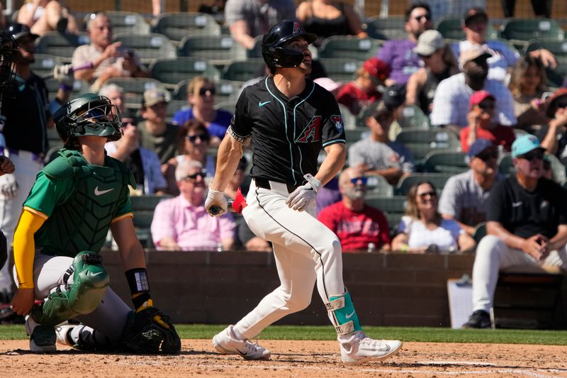 Mar 11, 2024; Salt River Pima-Maricopa, Arizona, USA; Arizona Diamondbacks Corbin Carroll (7) hits a single against the Oakland Athletics in the third inning at Salt River Fields at Talking Stick. Mandatory Credit: Rick Scuteri-USA TODAY Sports